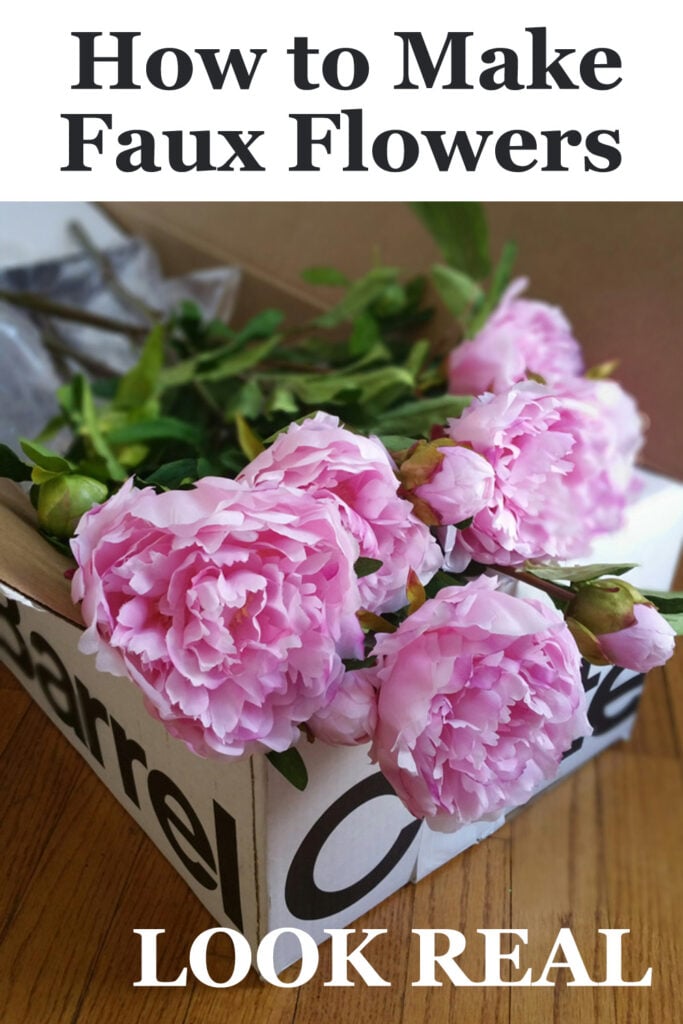 Pink peonies in a crate and barrel box. Text overlay says How to make faux flowers look. real.