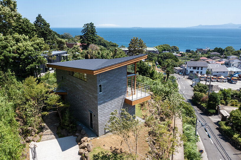 hybrid live-work spaces compose stone residence by FEDL in japanese hillside