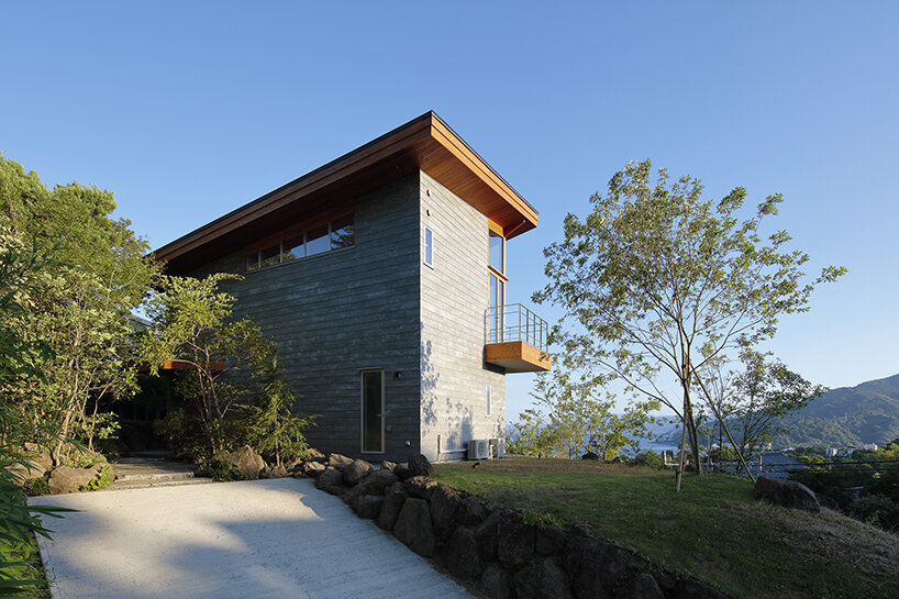 hybrid live-work spaces compose stone residence by FEDL in japanese hillside