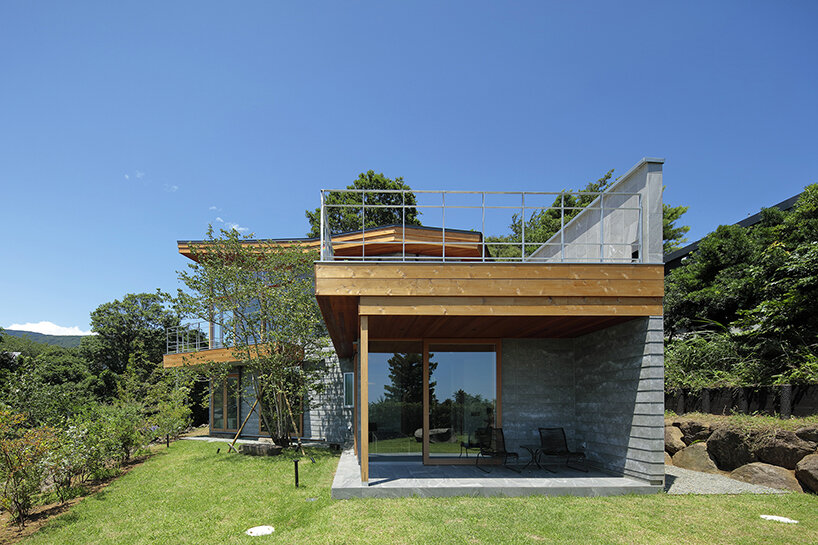 hybrid live-work spaces compose stone residence by FEDL in japanese hillside