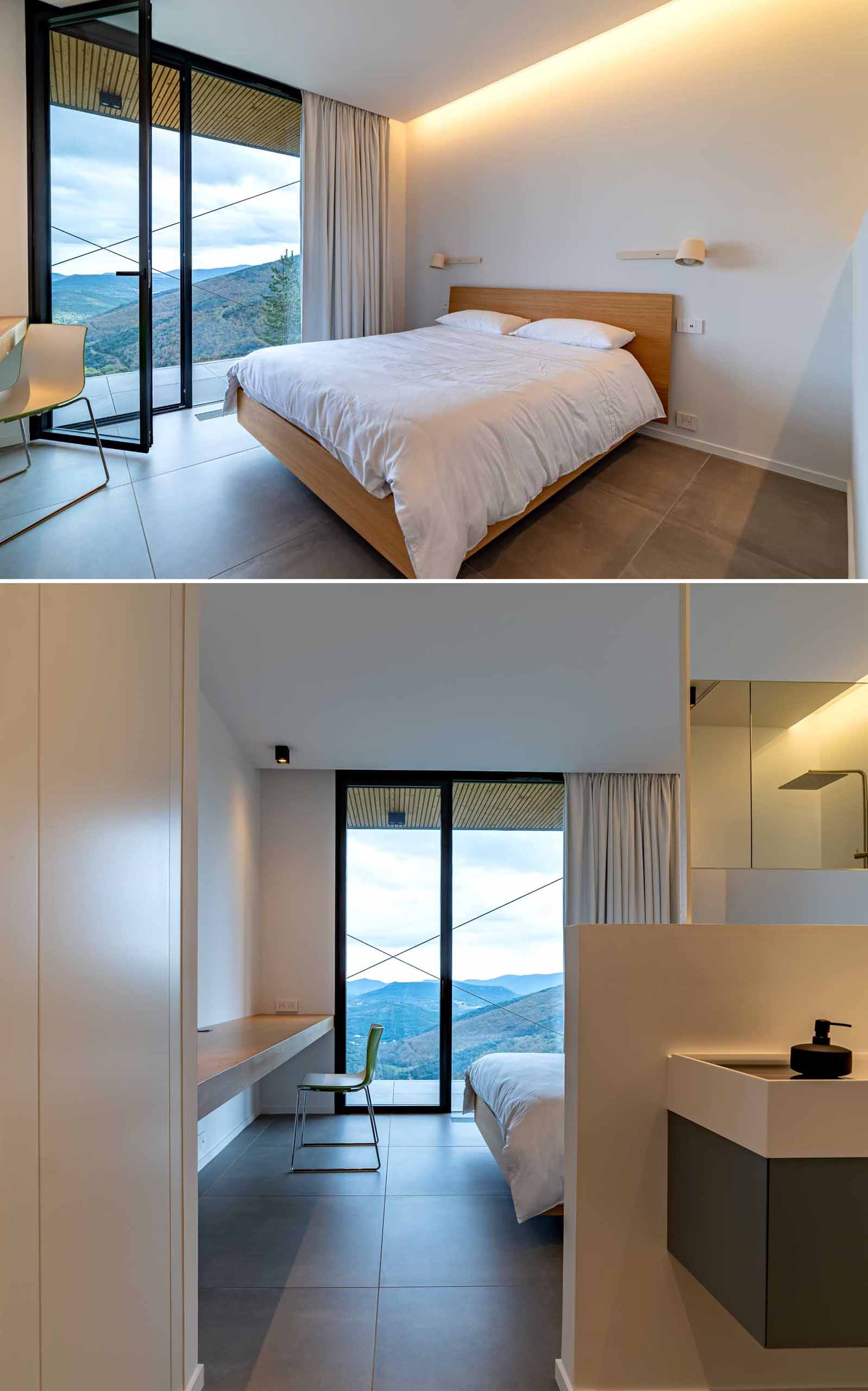 A modern bedroom with hidden lighting, a built-in desk, and an en-suite bathroom.