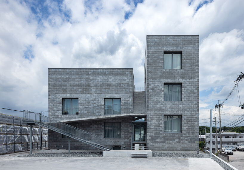 concrete blocks wrap bora architects' BLDG02 monolithic office building in japan