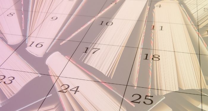 calendar grid over book tops with orange and pink gradient overlay