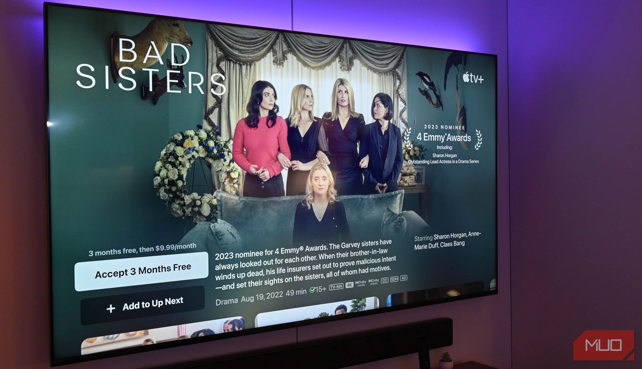 Colored lights behind a Smart TV with Apple TV open