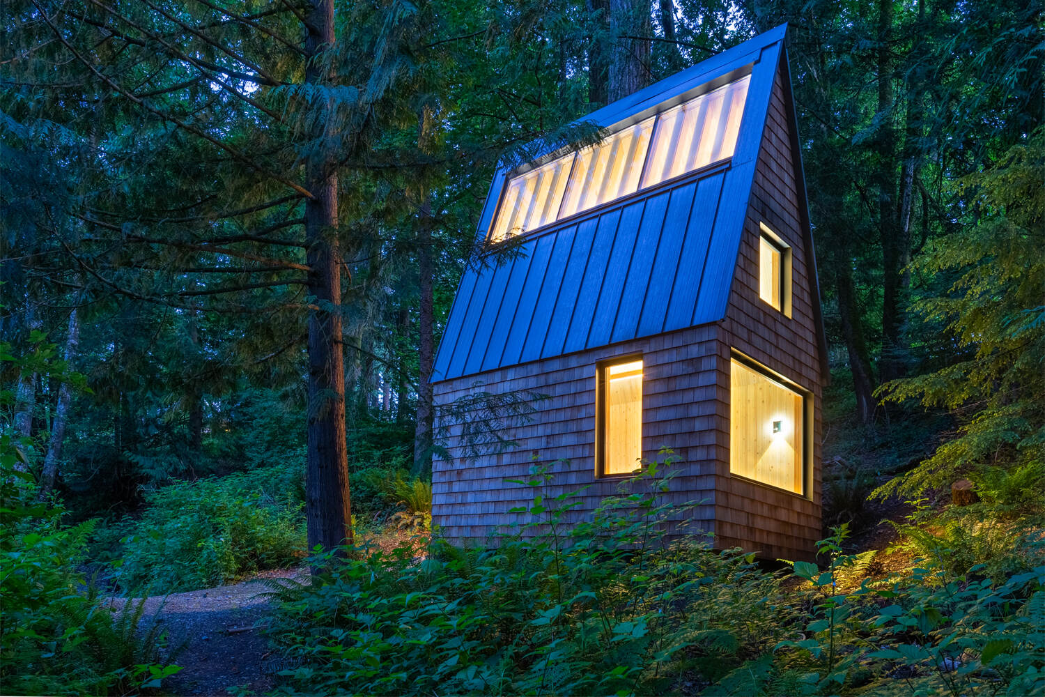 A small shingle-clad chapel.
