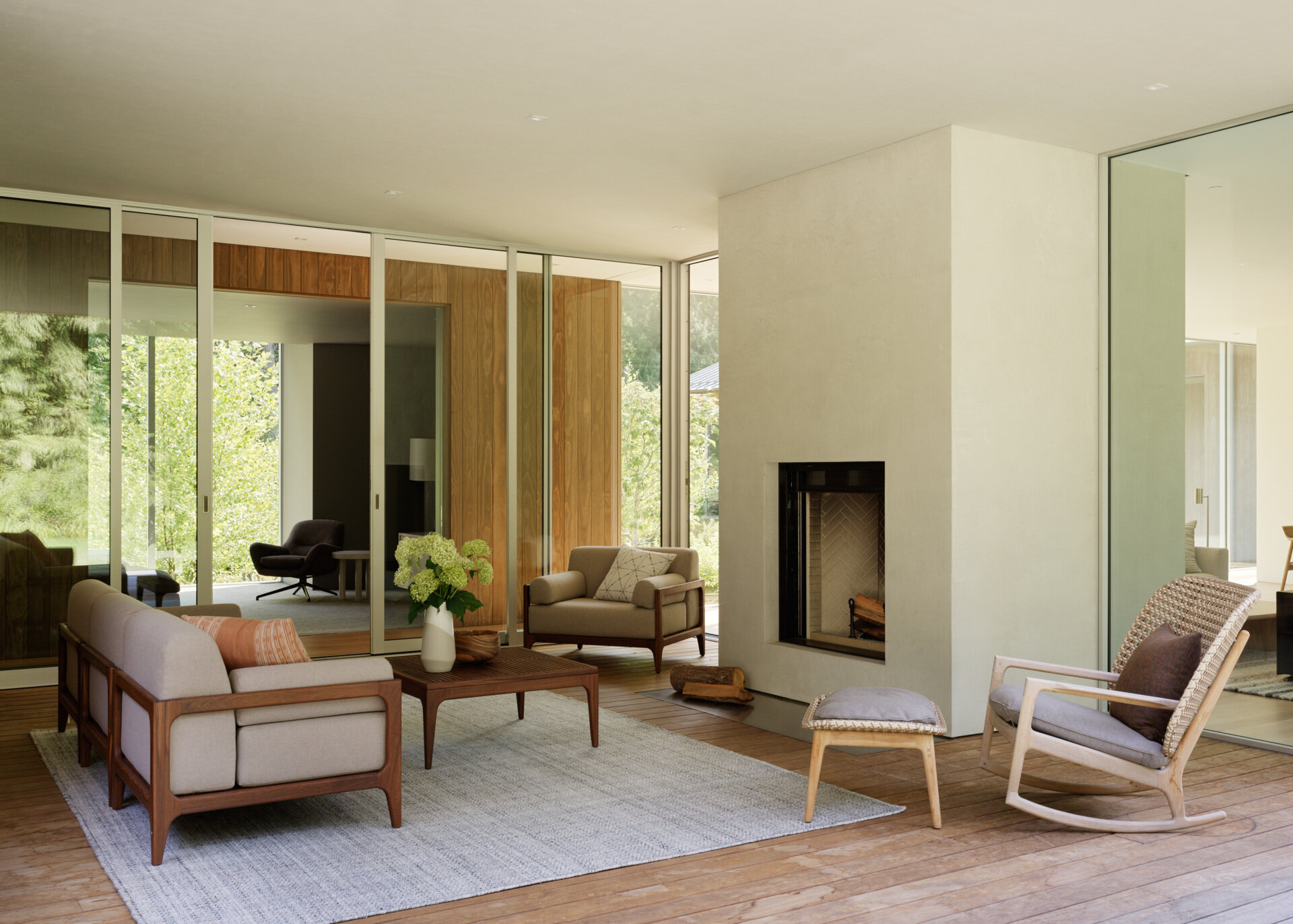 Near the main living areas of this house is a covered outdoor living room that blurs the line between interior and exterior, offering a shaded retreat that functions as a true extension of the house.