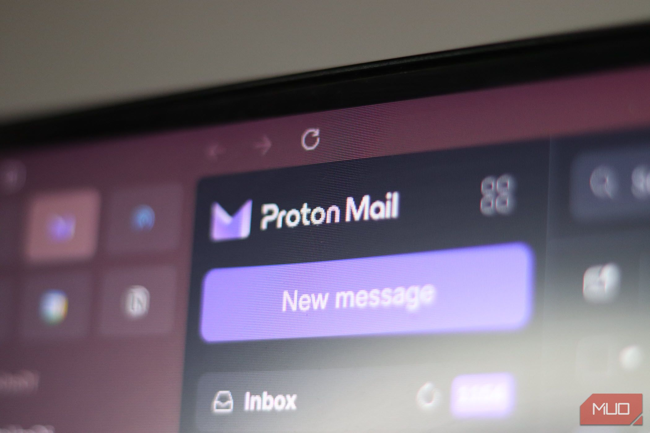 Monitor showing the Proton Mail logo