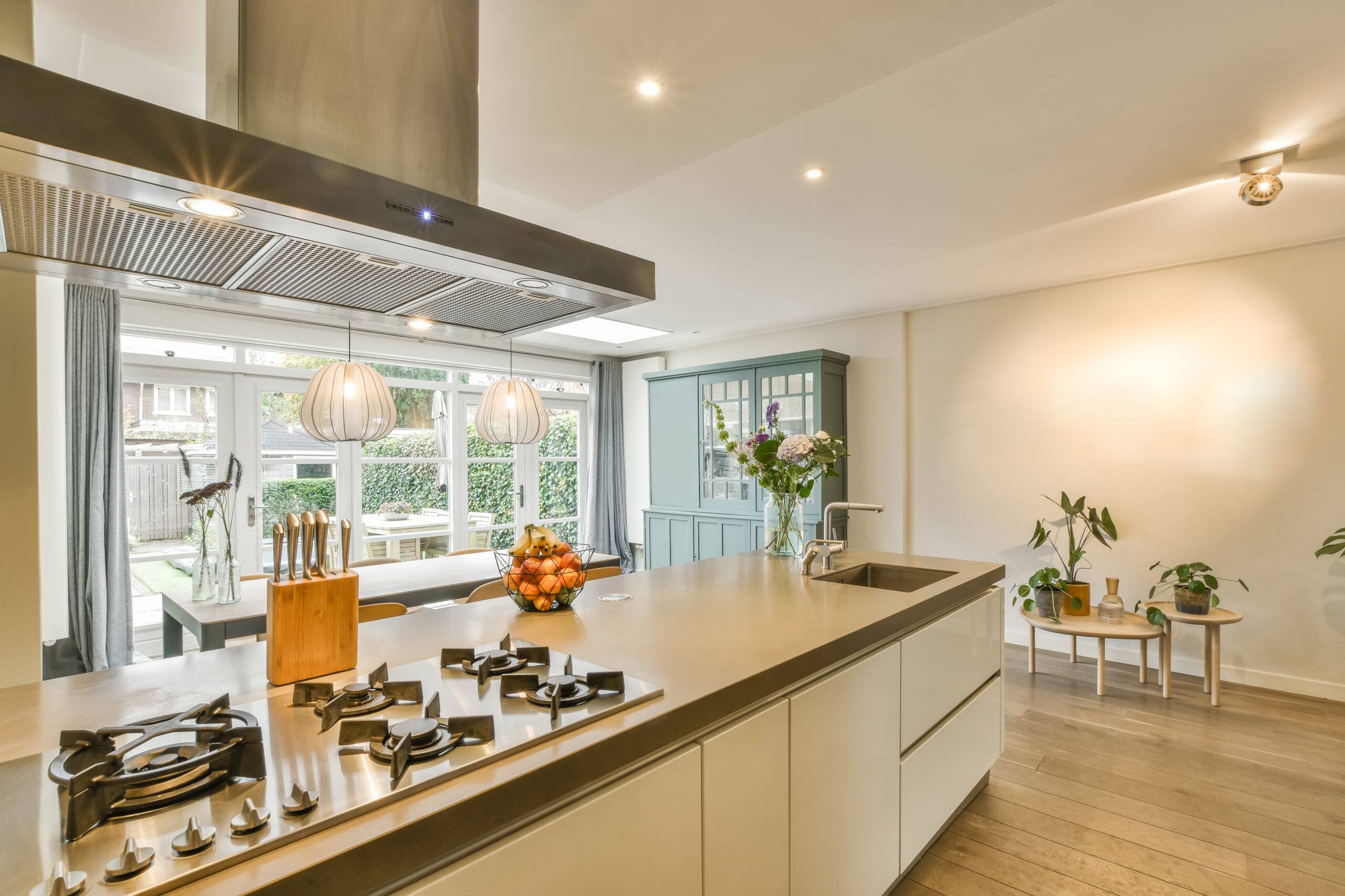 Cozy and strong kitchen area in daylight with flowers