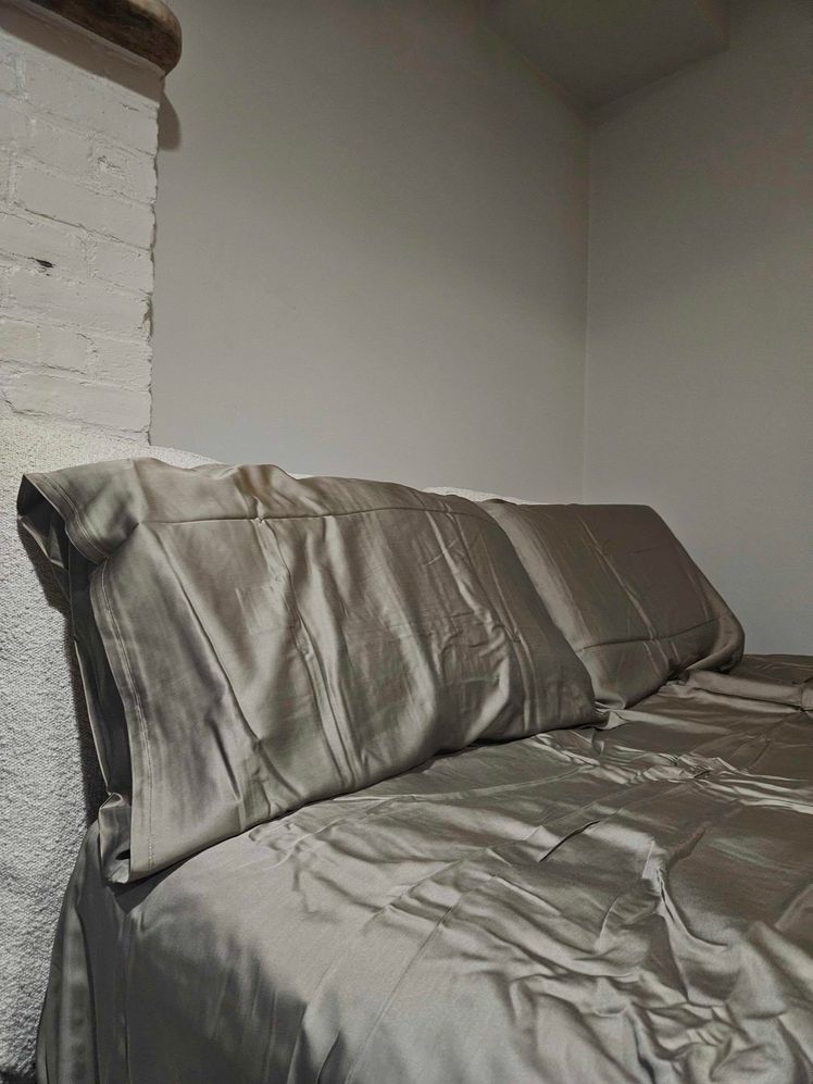 Taupe bamboo sheet set on a bed.