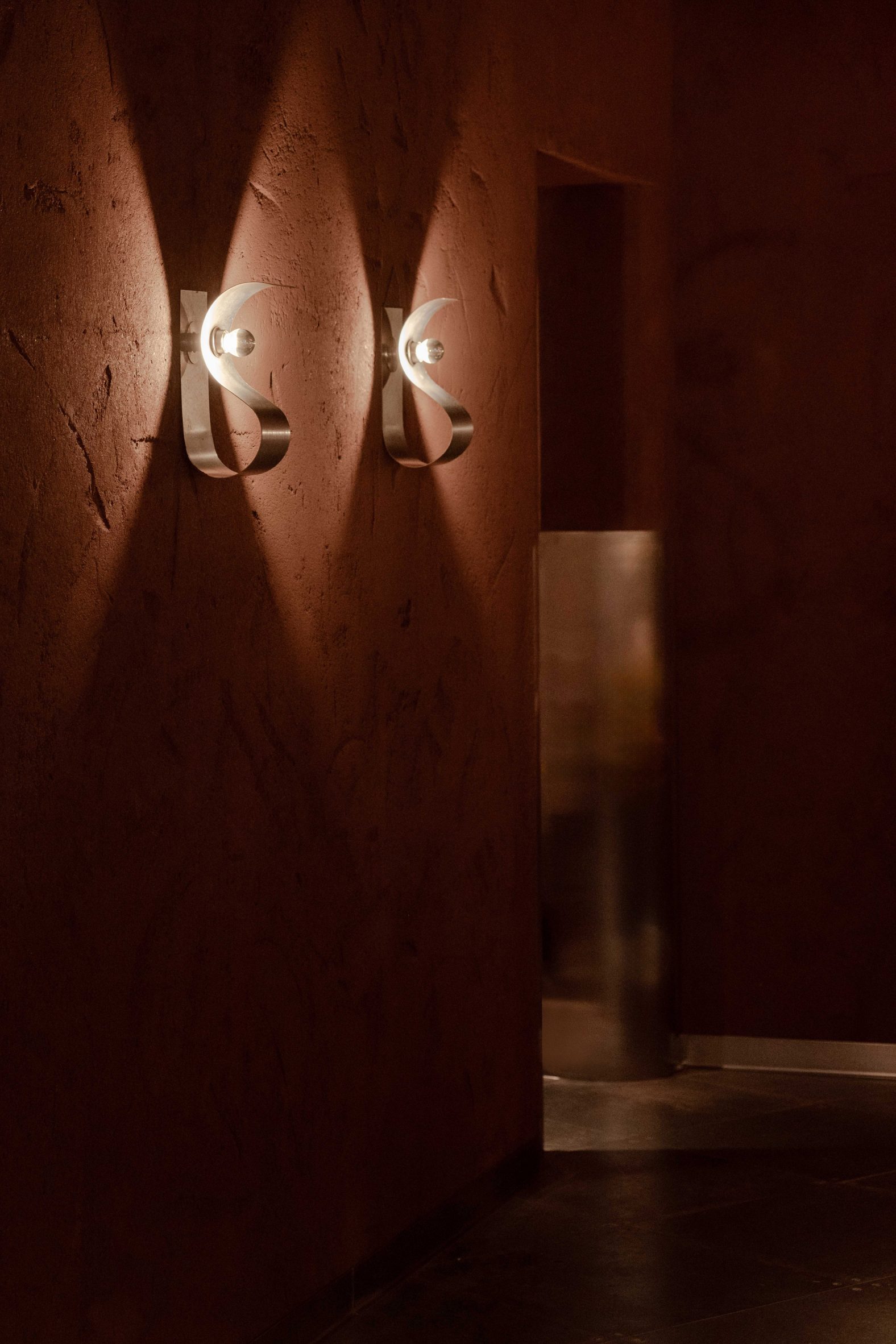 Metal lighting in London restaurant by Nina + Co