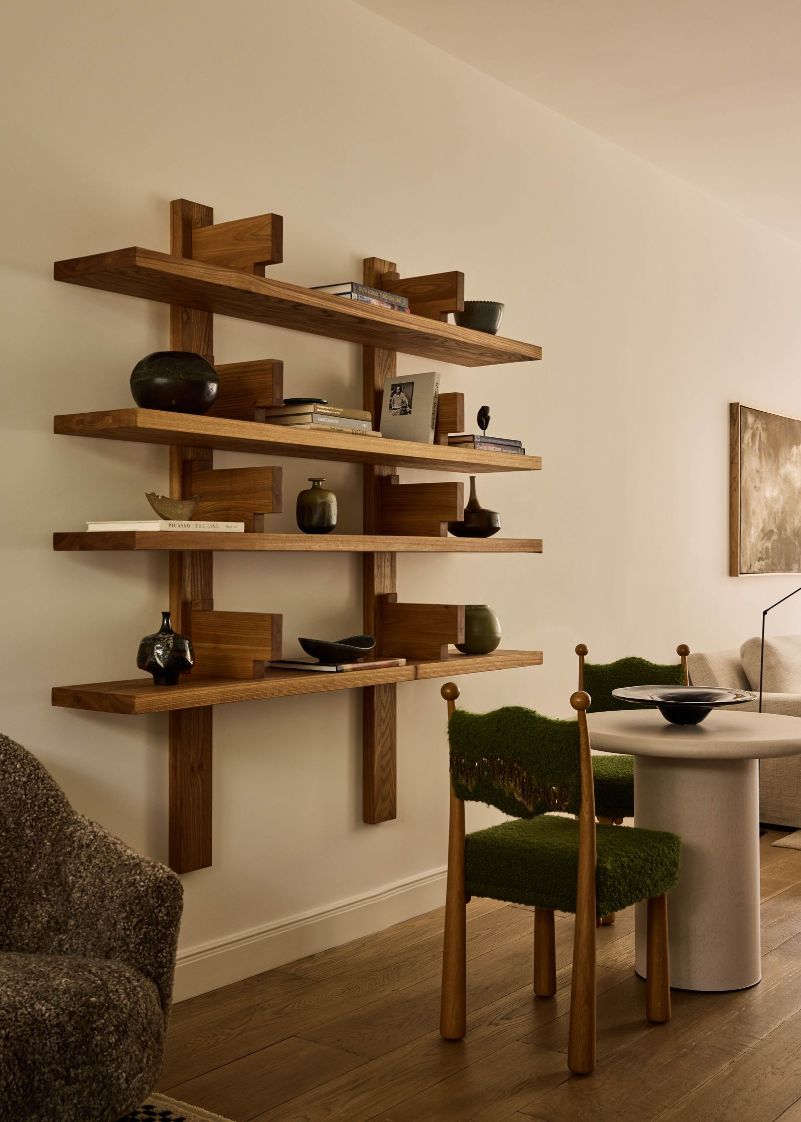 Image may contain Wood Hardwood Chair Furniture Stained Wood Indoors Interior Design Desk Table Shelf and Person