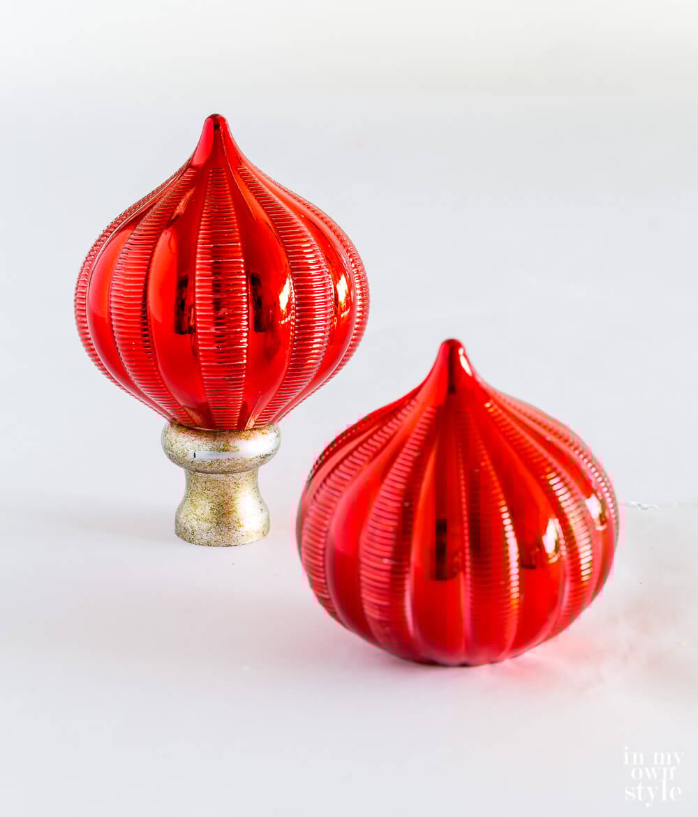 Two shatterproof Christmas ornaments made into lamp finials.