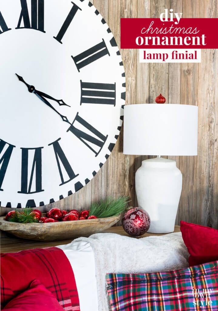 Rustic red and white corner of room decorated for Christmas. Text overlay says DIY Christmas ornament lamp finial