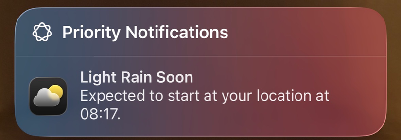 A priority notification on an iPhone from the Weather app, indicating that light rain will start soon.