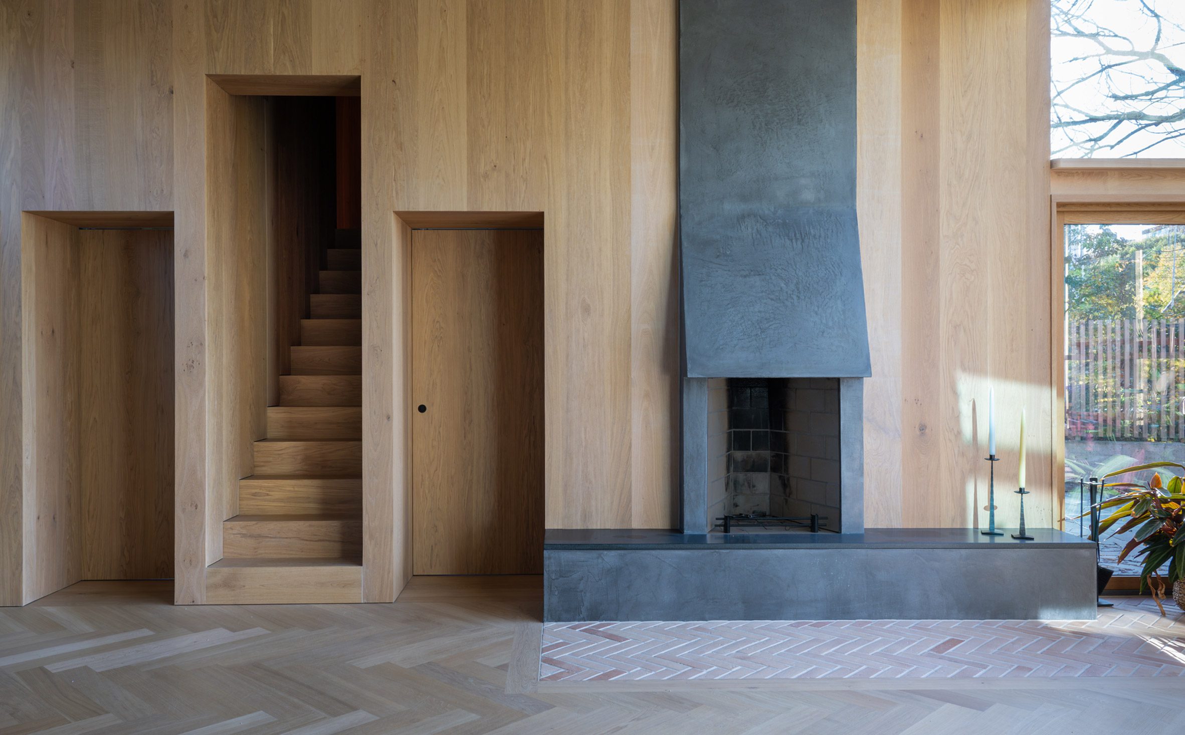 Timber wall with integrated fireplace and doors