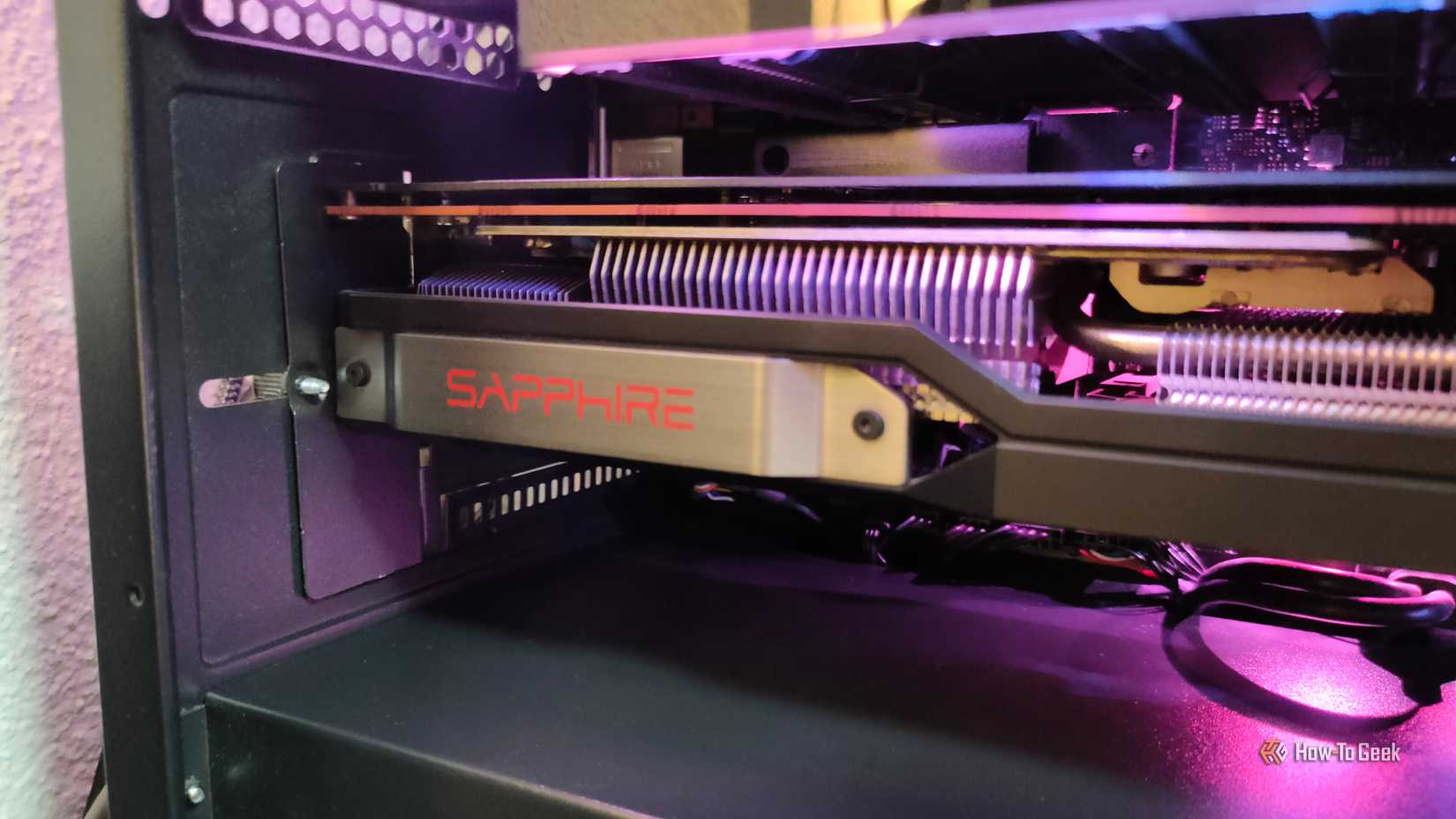 A closeup of an AMD RX 6800 XT Sapphire graphics card.