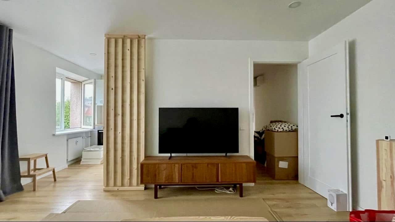 living-room-with-slatted-wall-to-hide-kitchen-fridge - IKEA Hackers best IKEA Hacks of 2025 - removable partition