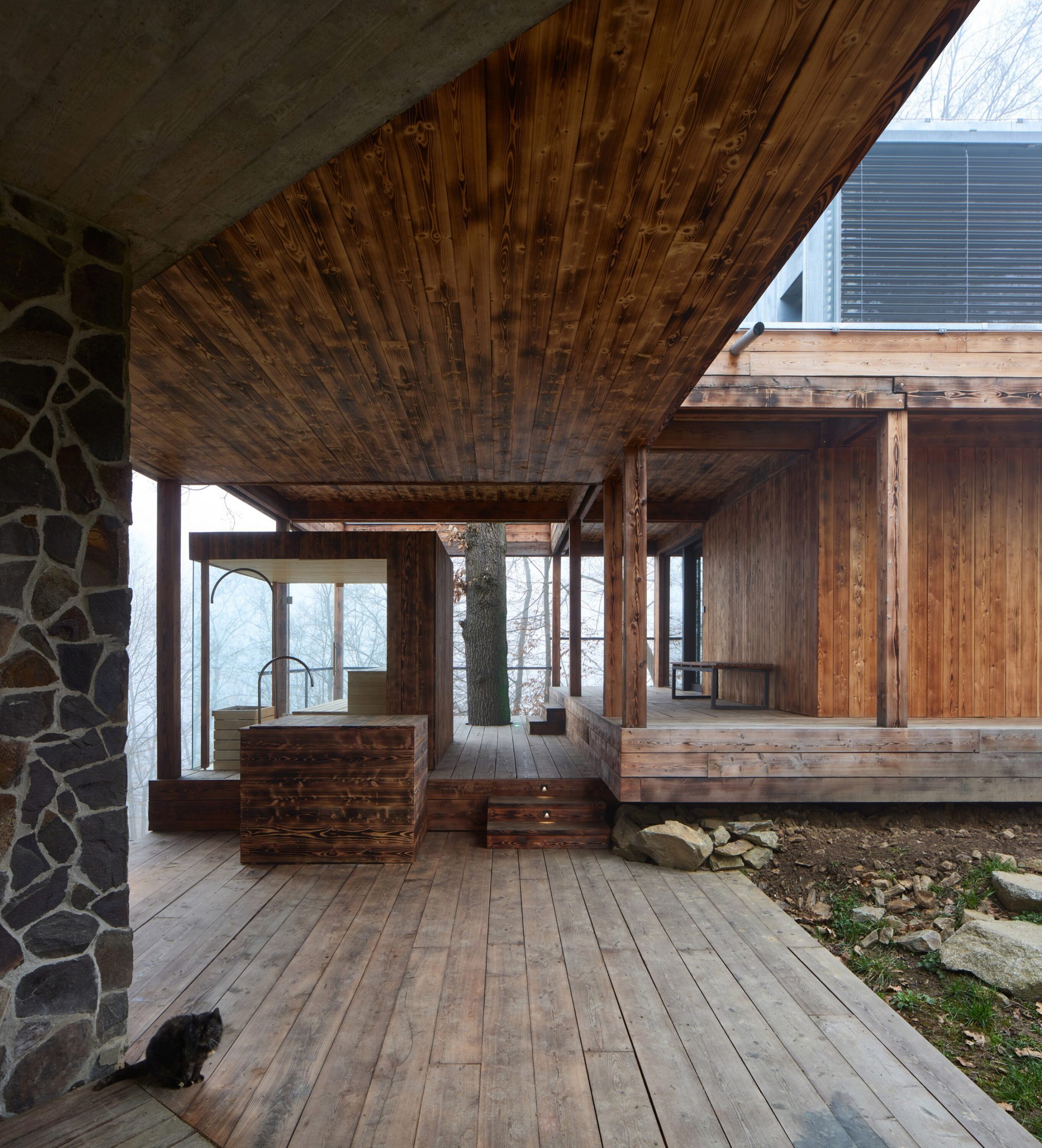 Sheltered area at Medník House by Päivä Architekti