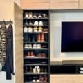 TV wall and entryway shoe storage with IKEA kitchen cabinets
